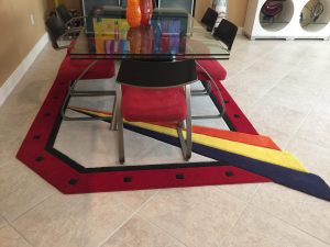 Glass table with colorful rug